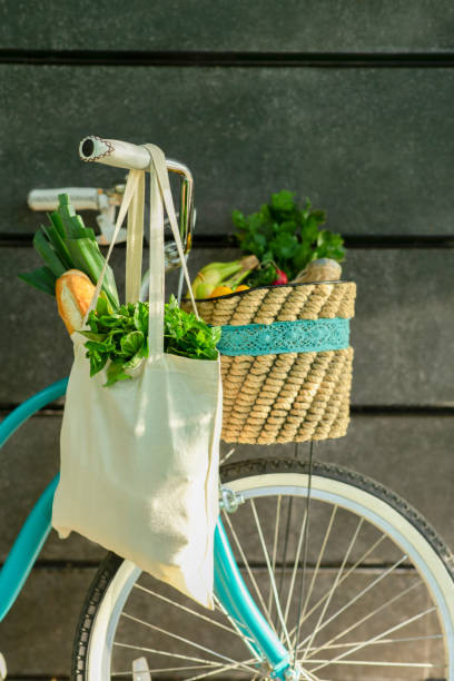 istock Bicycle with fresh products inside reusable shopping bags 1190579821