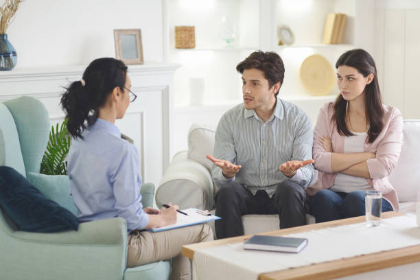 istock Determined husband explaining reasons of cheating his wife 1190580021