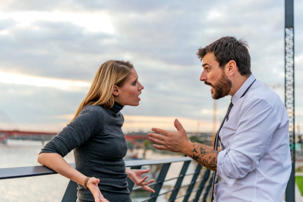 istock Young Man and his Girlfriend are Arguing Near the River 1190580227