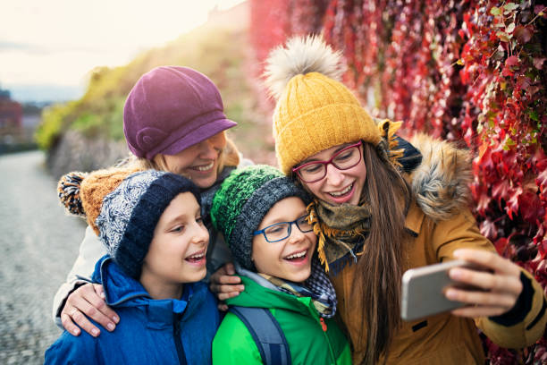 Family taking selfies on Autumn walk
