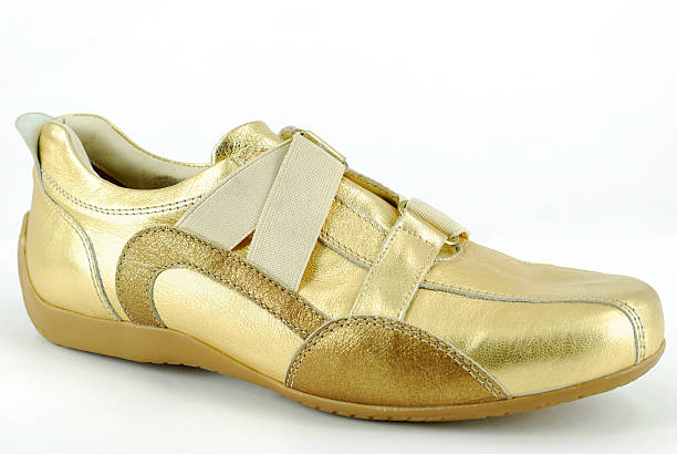 istock woman gold sneaker shoe 119058377