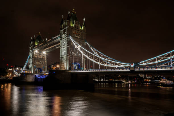 istock Illuminated London Tower Bridge Over River At Night 1190584723