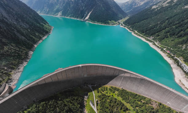 Aerial panorama of Schlegeis Stausee reservoir dam and panoramic Alpine Road in the Zillertal Alps, Tirol, Austria. Aerial panorama of Schlegeis Stausee dam, Austria. zillertaler alps stock pictures, royalty-free photos & images