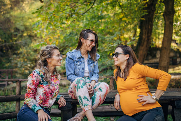 istock Three beautiful ladies sitting in park 1190588591