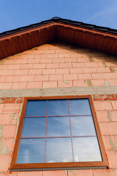 istock Interior of a Unfinished Red Brick House Walls under Construction without Roofing 1190588674