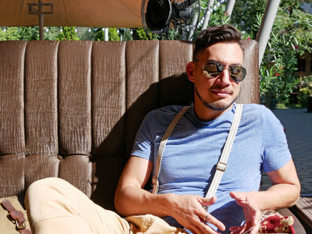 istock Young man with sunglasses in cafe 1190588901