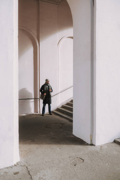 Male worker is waiting for somebody in underground