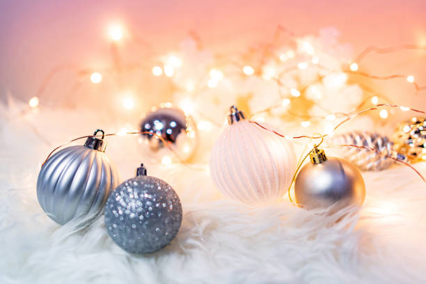 istock Christmas ball on hairy carpet with festive lights 1190589315