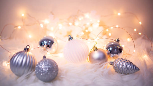 istock Christmas ball on hairy carpet with festive lights 1190589335
