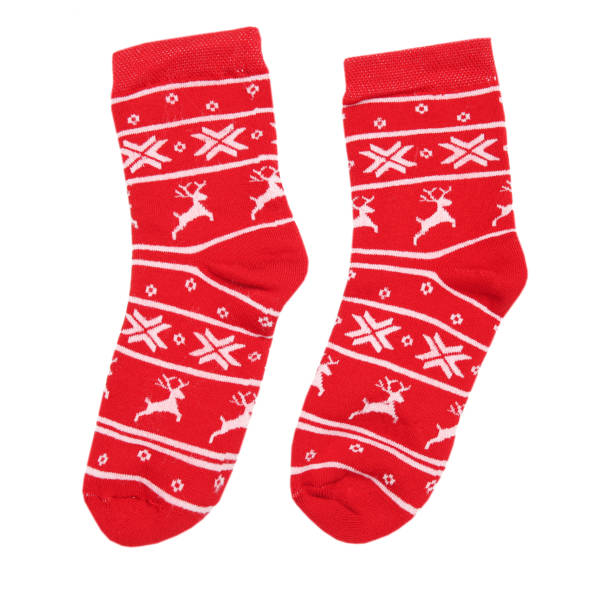 istock Red christmas socks isolated on white. 1190590037