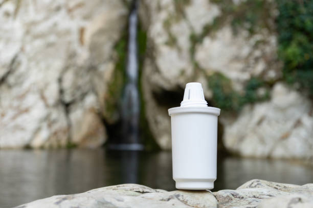 istock Filter for water jugs on the background of a mountain stream or river 1190590186