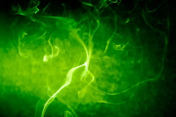 Photo of Green swirling smoke abstract close up