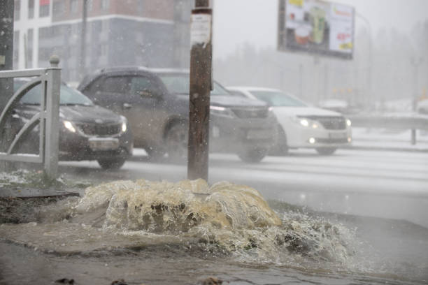istock sewerage breakthrough from the hatch in the winter 1190590577