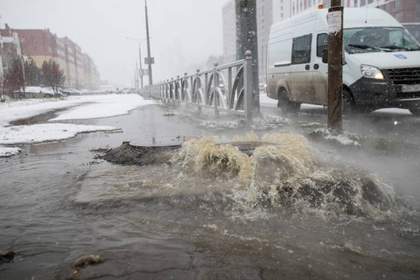 istock sewerage breakthrough from the hatch in the winter 1190590608