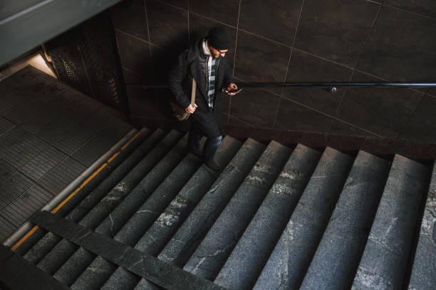 istock Caucasian man is walking upstairs in underground 1190591711