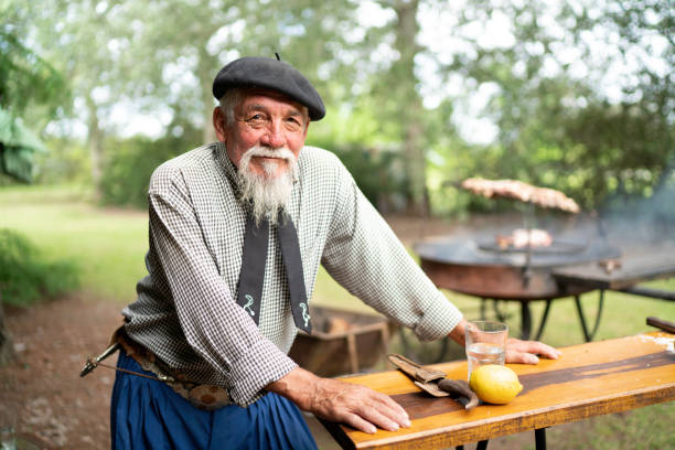 Portrait of a senior gaucho preparing barbecue in gaucho stock pictures, royalty-free photos & images