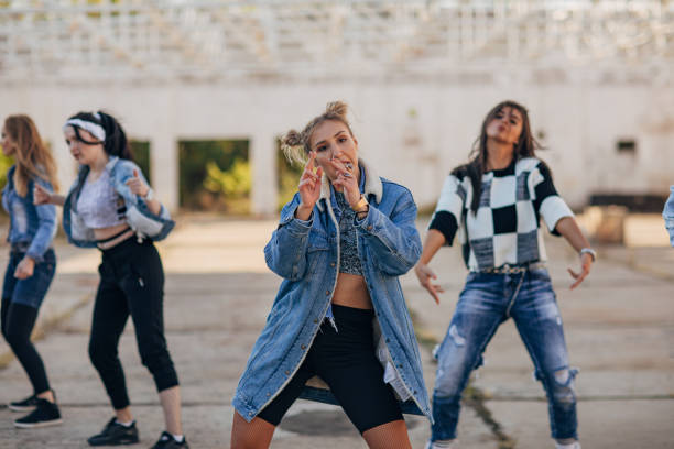istock Group of young ladies dancing together 1190594359