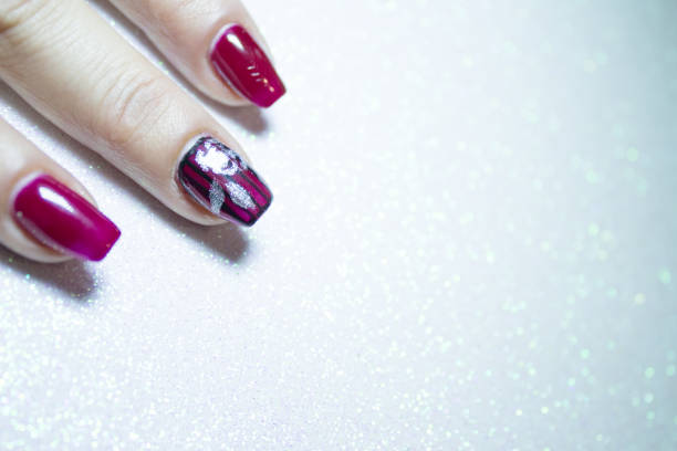 istock Female manicure in red tones. Copy space 1190595534