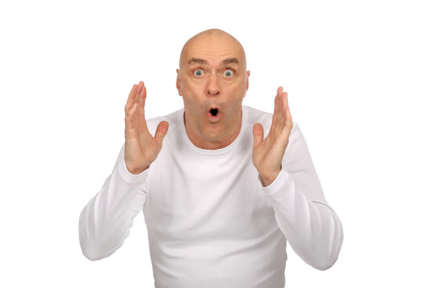 Man with bald head and white shirt is excited in the studio