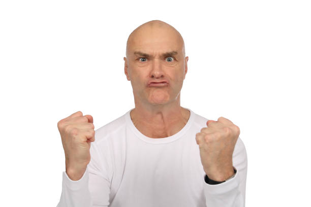 istock Man with bald and white shirt is excited in the studio 1190596638