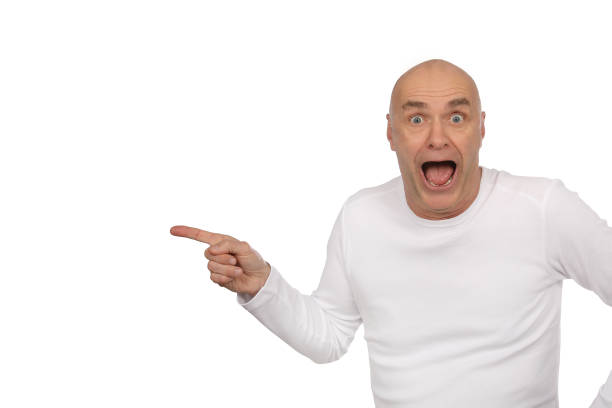 istock Man with bald and white shirt is excited in the studio 1190597161