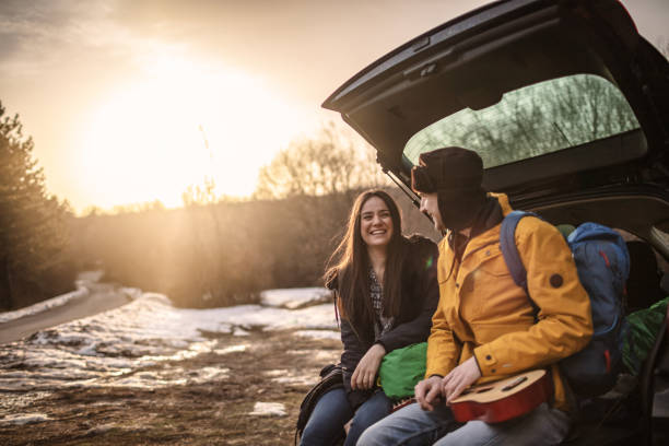 istock Yong couple with guitar in car trunk 1190597889