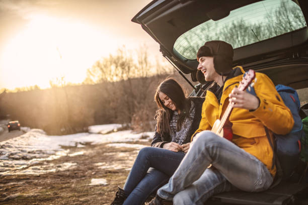 istock Yong couple with guitar in car trunk 1190598854