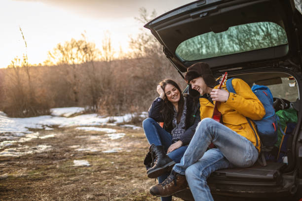istock Yong couple with guitar in car trunk 1190599748