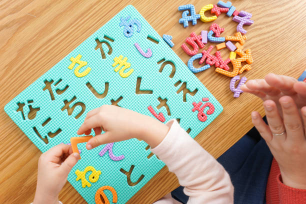istock Child and parent studying at home 1190600523