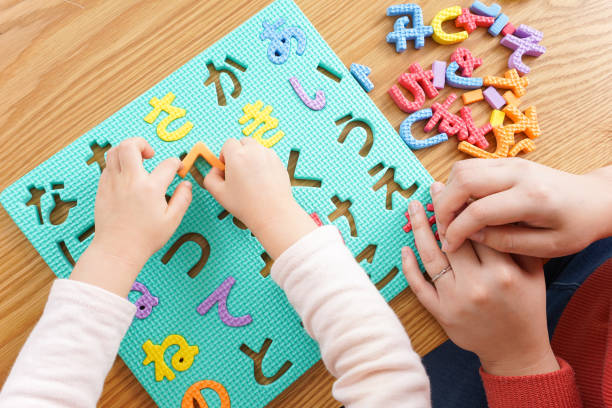 istock Child and parent studying at home 1190600545