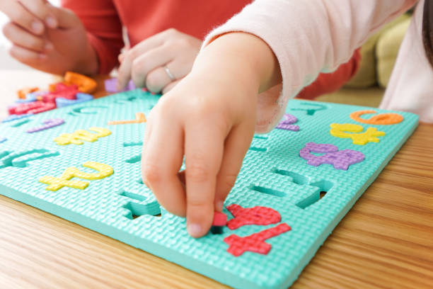 istock Child and parent studying at home 1190600556