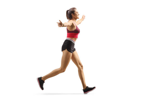 istock Happy young woman jogging and spreading arms 1190600575