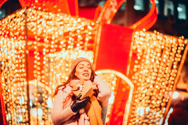 istock Happy young woman with Christmas present box 1190600636