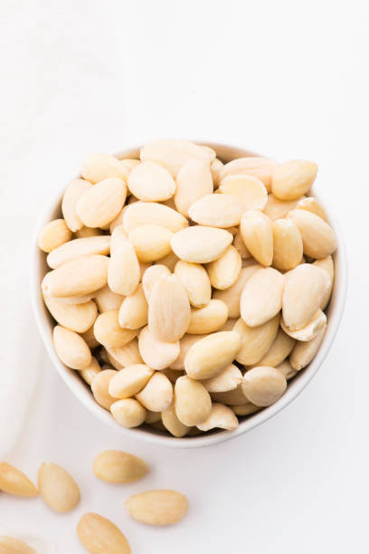 istock Bowl of almonds on a white background 1190600900