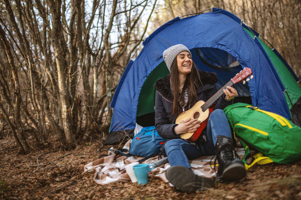 istock Young woman camping in nature 1190600922