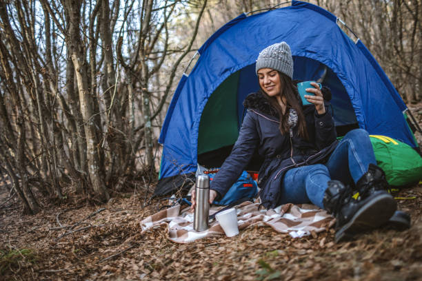 istock Young woman camping in nature 1190601138