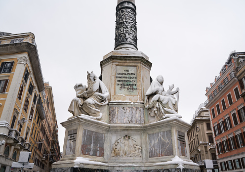 Rome, Italy - February 26, 2018 Lover part of Colonna dell'Immacolata with statues of Moses and King David during rare blizzard