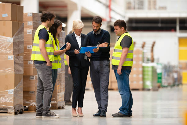 istock Warehouse staff meeting 1190602131