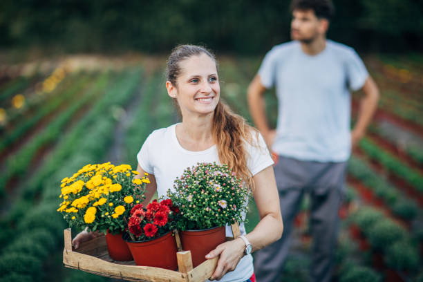 istock Lady working outdoors on flower farm 1190602257