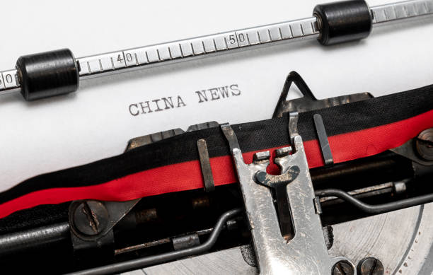 istock China News on a classic typewriter 1190602347
