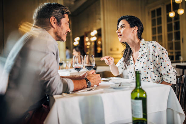 istock Couple fighting in elite restaurant 1190604308