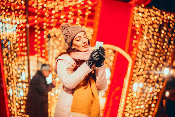 istock Young girl is taking selfie in the night 1190605537
