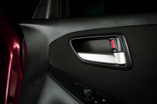 istock Car door lock / unlock button and metallic handle. 1190605759