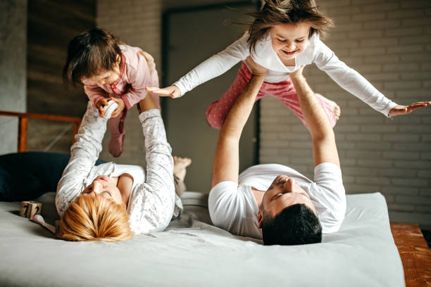 istock Morning fun in bed with kids 1190607191
