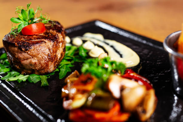 istock Delicious beef steak on a plate, close-up. 1190607238