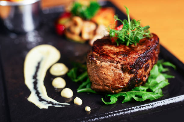 istock Delicious beef steak on a plate, close-up. 1190607257