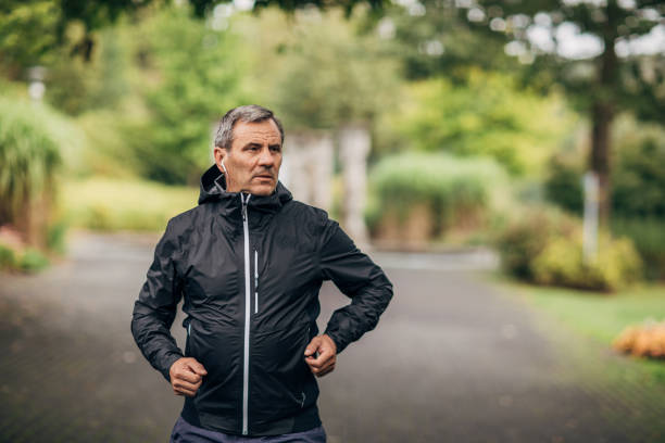 istock Senior gentleman running alone in park 1190613324