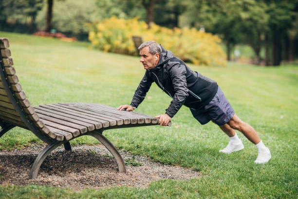 istock Senior man exercising in park alone 1190616571