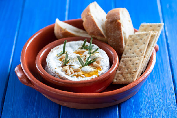 istock cheese camembert with nuts and rosemary in ceramic dish 1190617826
