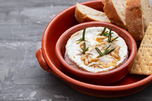 istock cheese camembert with nuts and rosemary in ceramic dish 1190617829
